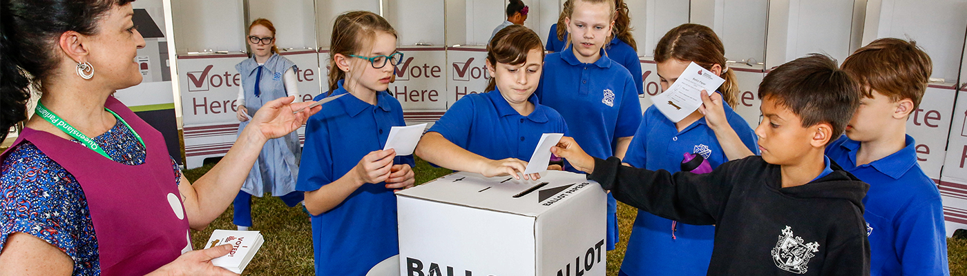 Students entering votes in mock ballot