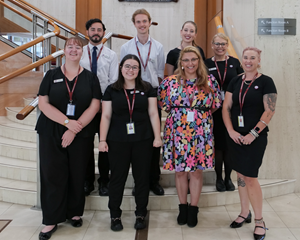 a group of people standing at the bottom of stairs