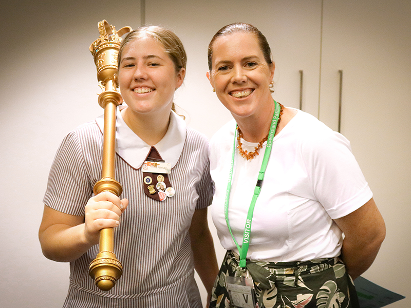 Teacher with student holding mace