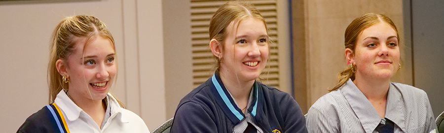 Students listening to debate