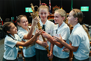 students holding mace